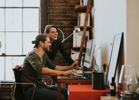 An advisor and client reviewing a portfolio together